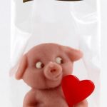BIO herziges Schwein sitzend